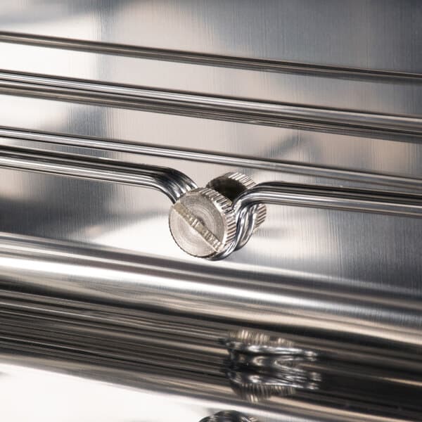 A stainless steel rack support for an Avantco convection oven.