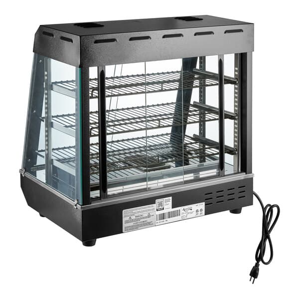 A countertop heated display case with three wire shelves, glass sides, and sliding doors, designed for keeping food warm.