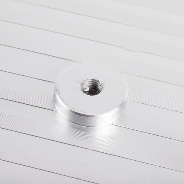 A silver metal blade cover with a metal nut.