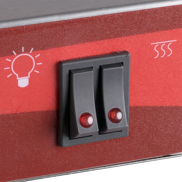 A close-up of the red and black switch on an Avantco Freestanding French Fry Warmer.