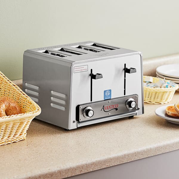 An Avantco commercial toaster with four slots on a counter.