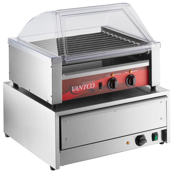 An Avantco hot dog roller grill with a sneeze guard over hot dogs.