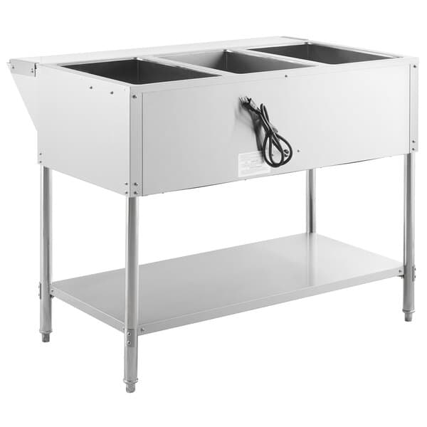 An Avantco stainless steel electric steam table with an undershelf holding three large containers.