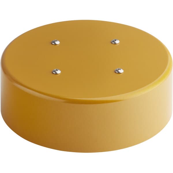 A yellow circular metal base with silver screws and four holes.