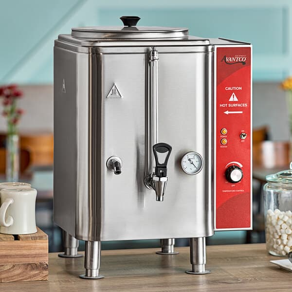 An Avantco hot water dispenser on a stainless steel counter.