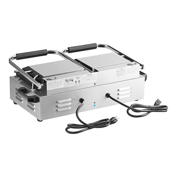 An Avantco commercial dual panini sandwich grill with grooved plates and black handles.