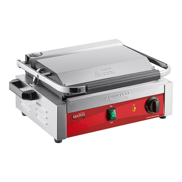 An Avantco commercial panini grill with red panel and black handles.