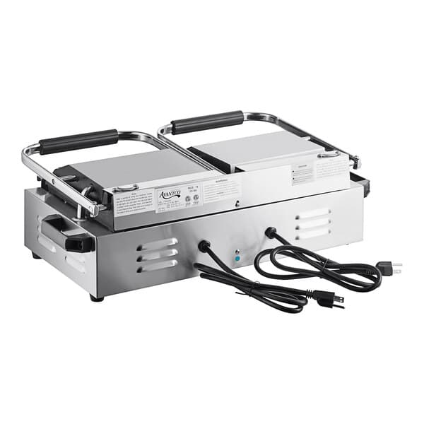 An Avantco stainless steel commercial dual panini sandwich grill on a counter.