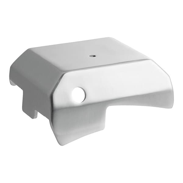 A silver metal cover with a hole in the middle.