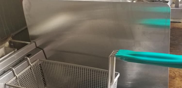 Keeps fryer oil from getting on the flat top.