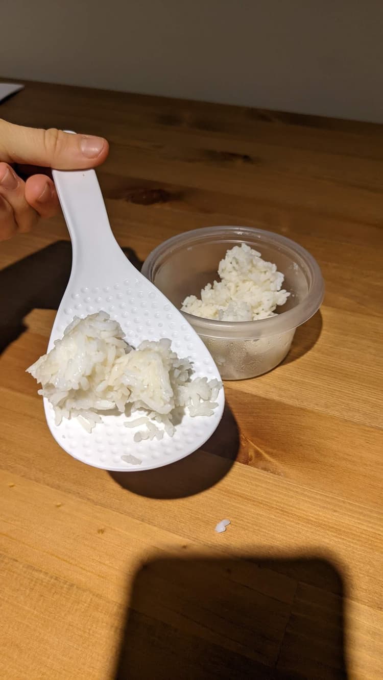This rice spoon has little dimples that help you pick up the rice without it dropping as much.