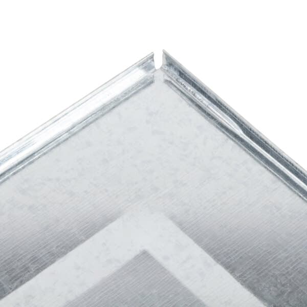 A close-up of a silver metal crumb tray with white and grey accents.