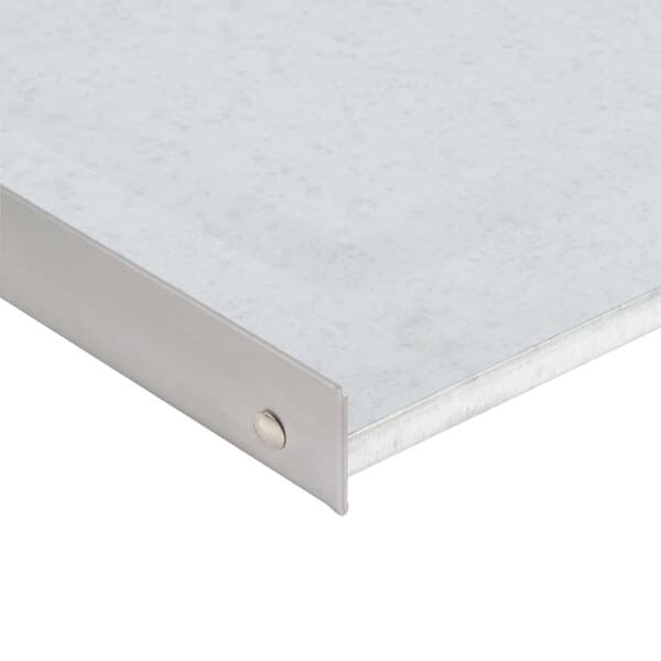 A close-up of a metal crumb tray.