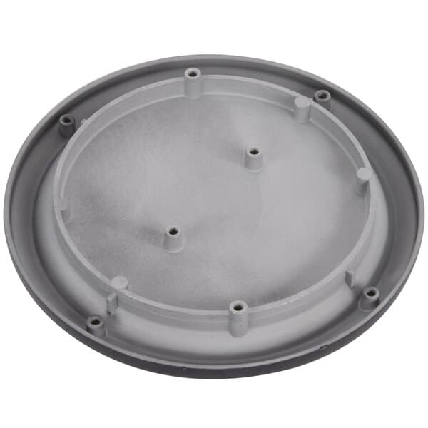 A grey circular warming plate with holes.