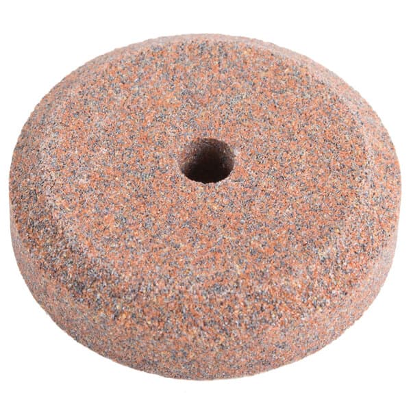 A circular sharpening stone with a hole in the middle.