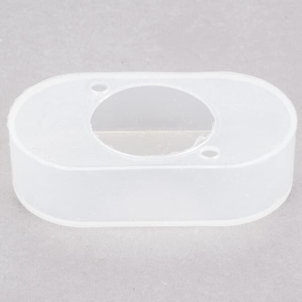 A white plastic switch cover with a hole in it.