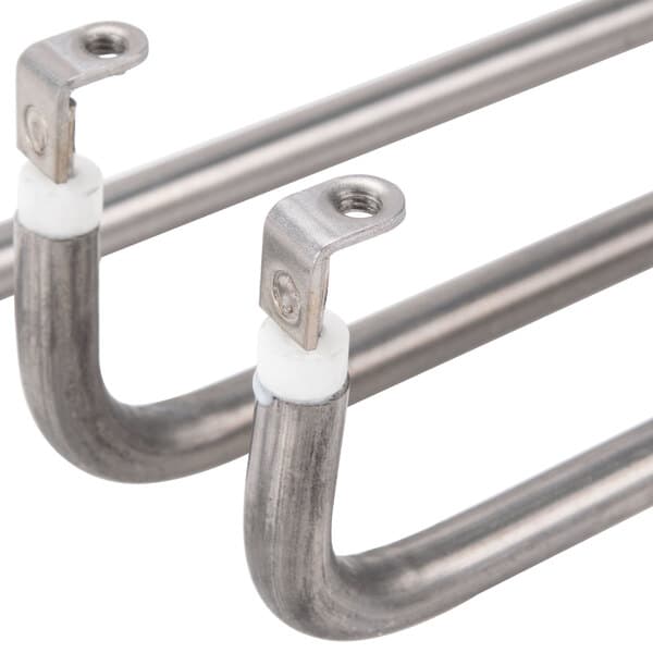 A close-up of a metal rod with a metal corner and hole.