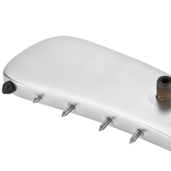 A silver rectangular object with metal spikes.