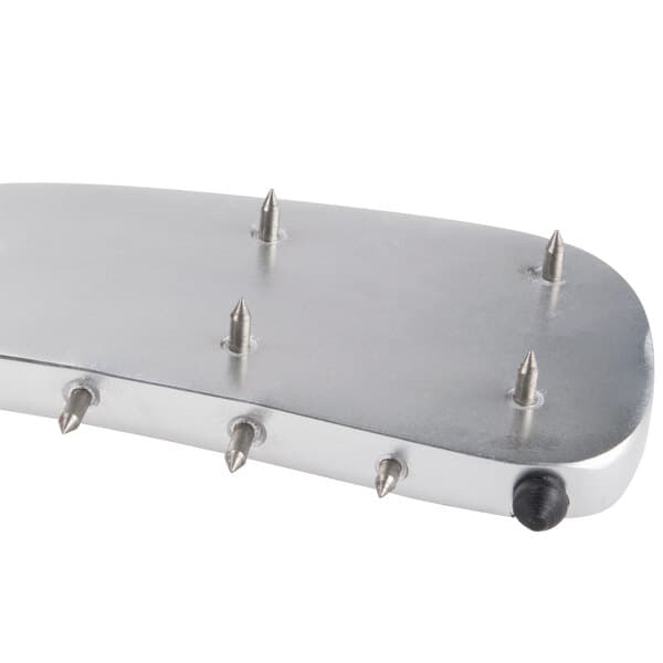A silver metal plate with spikes on it, the Avantco 177SL310ARM pusher arm.