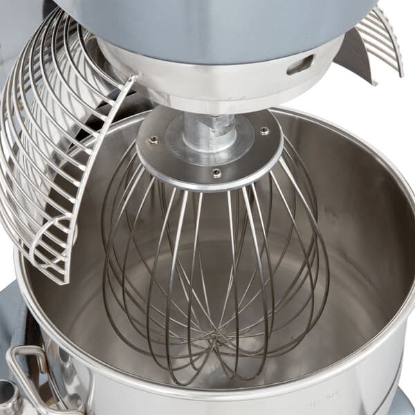 An Avantco mixer with a wire whip inside.