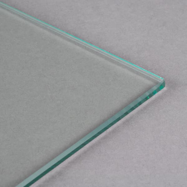 A clear glass surface with a thin green edge.