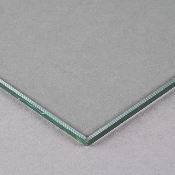 A close-up of a corner of an Avantco glass panel.