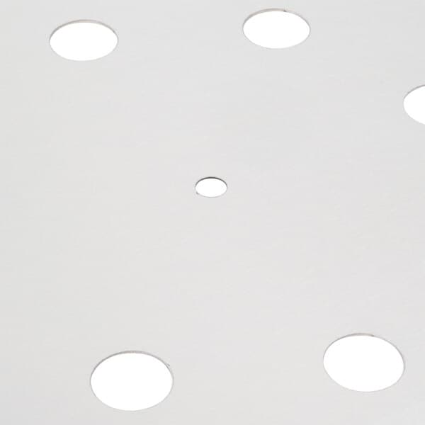 A white circle with holes in it.