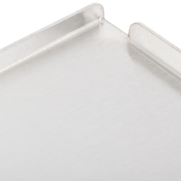 An Avantco metal bun plate on a white surface.