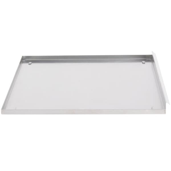 A metal tray with a white background and a metal handle.