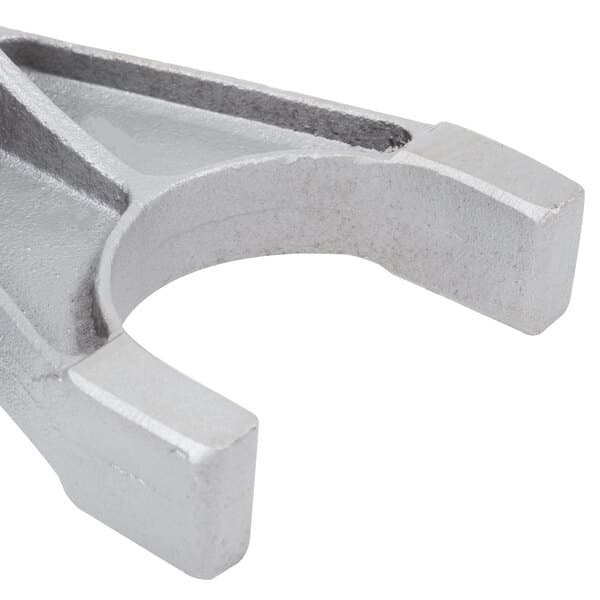 A silver metal Avantco fork with a curved end.