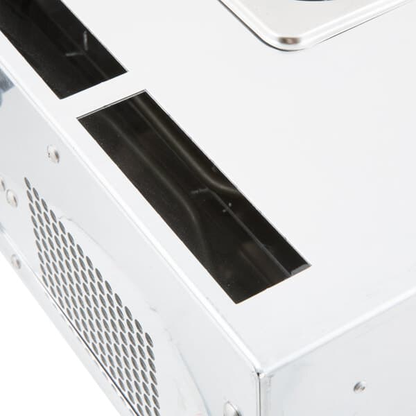 A close up of a silver box with a machine inside.