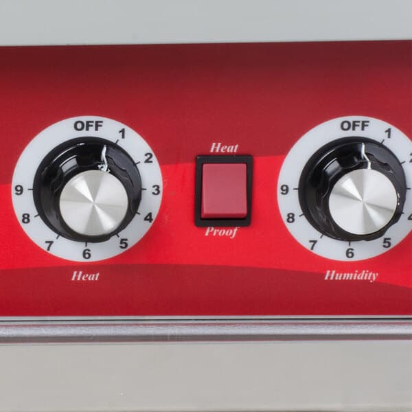 A red and white control panel with a dial and buttons.