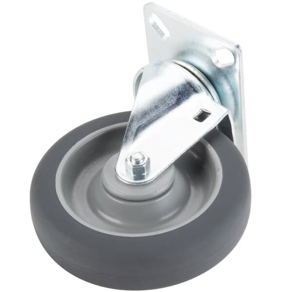 A metal plate with a grey wheel and a screw attachment.
