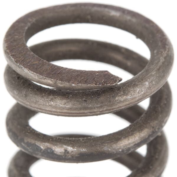 A close-up of an Avantco lock spring with a metal ring on top.