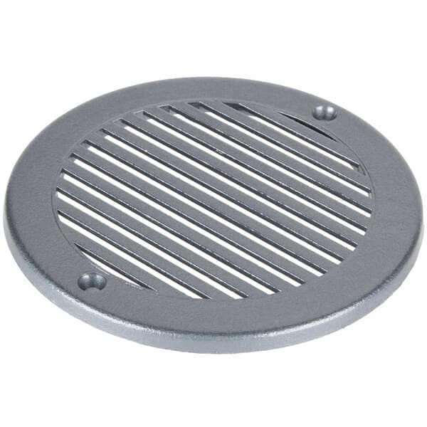 A round metal drain cover with holes.