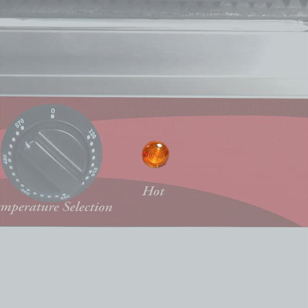 An Avantco orange round signal light on a counter.