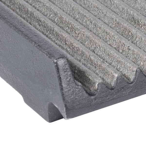 An Avantco grooved metal grill plate with a black metal surface.