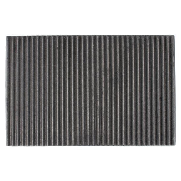 A black rectangular grill plate with grooves on the surface.