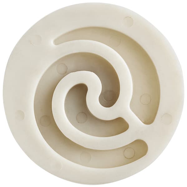 A white circular plastic part with a spiral inside.