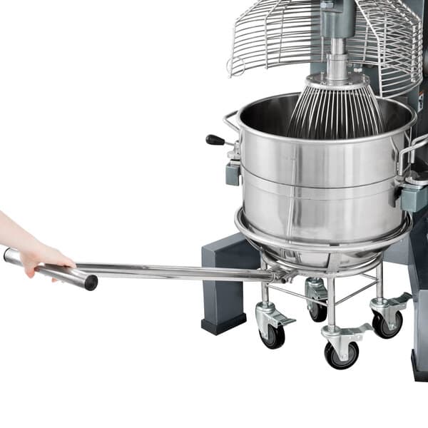 A person using an Avantco bowl truck to carry a large metal mixer bowl.