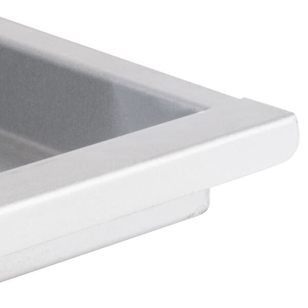 An Avantco white metal grease tray with a handle.