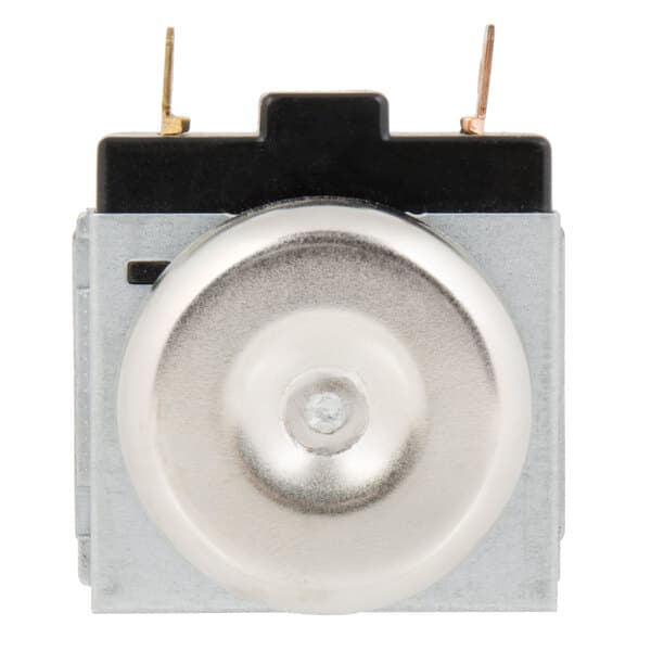 A close up of a small metal silver timer with a round metal object.