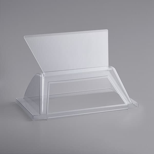 A clear plastic box with a black border and a clear lid over a white rectangular object.