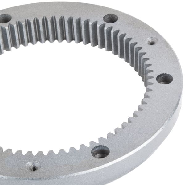 A close-up of the Avantco turning plate gear ring with holes and gears.