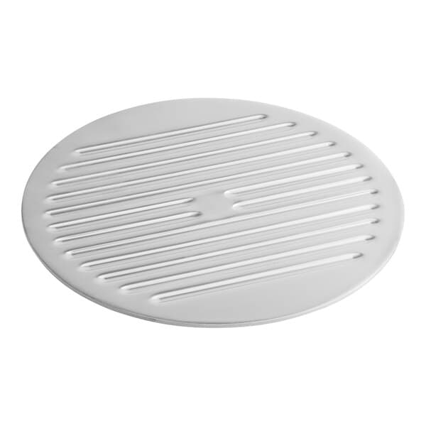 A round white metal blade cover with lines on it.