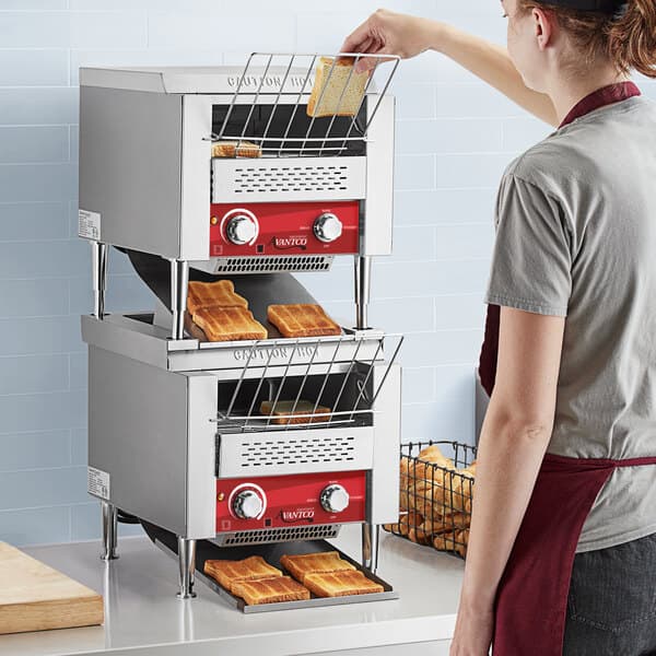 a toaster machine with toast on top