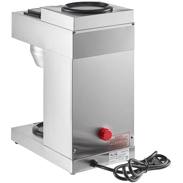 a silver machine with a red button