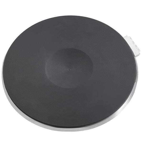 A black circular object with a metal handle.