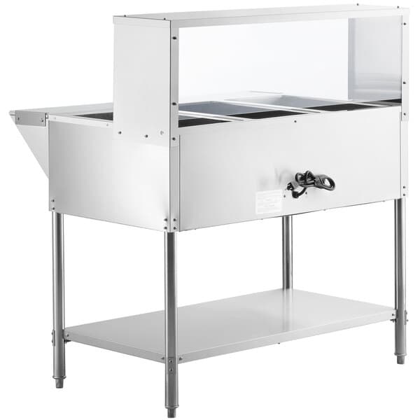 A stainless steel Avantco electric steam table with glass sneeze guard shelves.