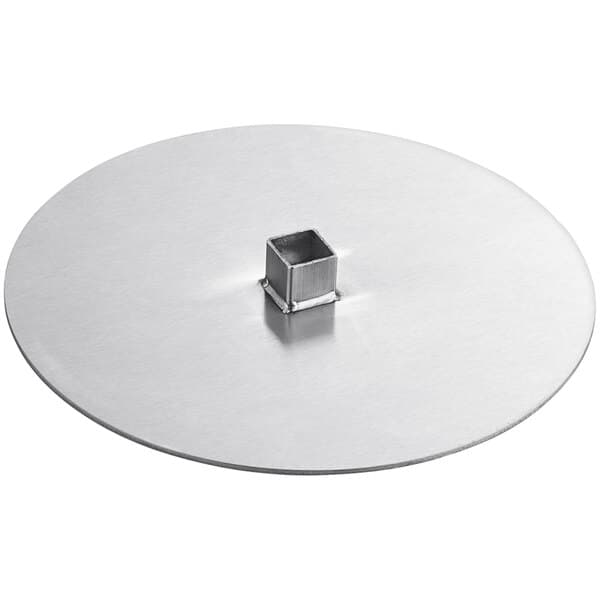 A silver circular metal plate with a square hole in it.